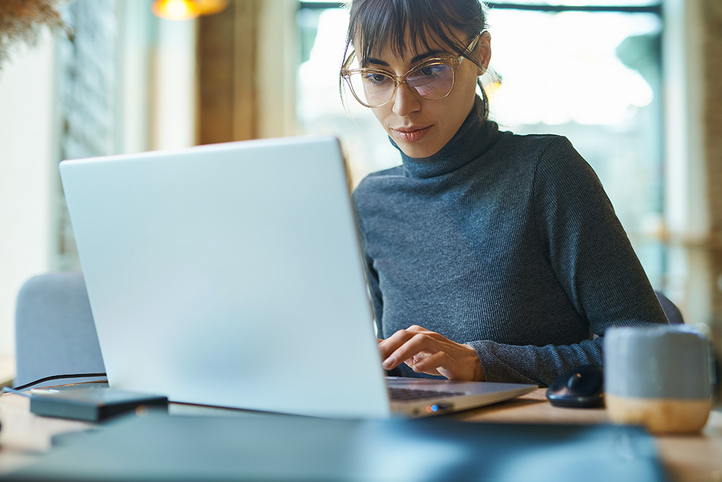 woman working on laptop from home office