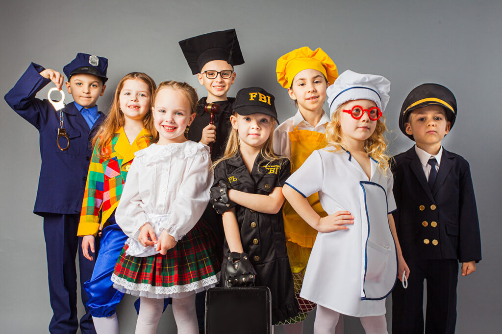 Group of children dressed in different career uniforms