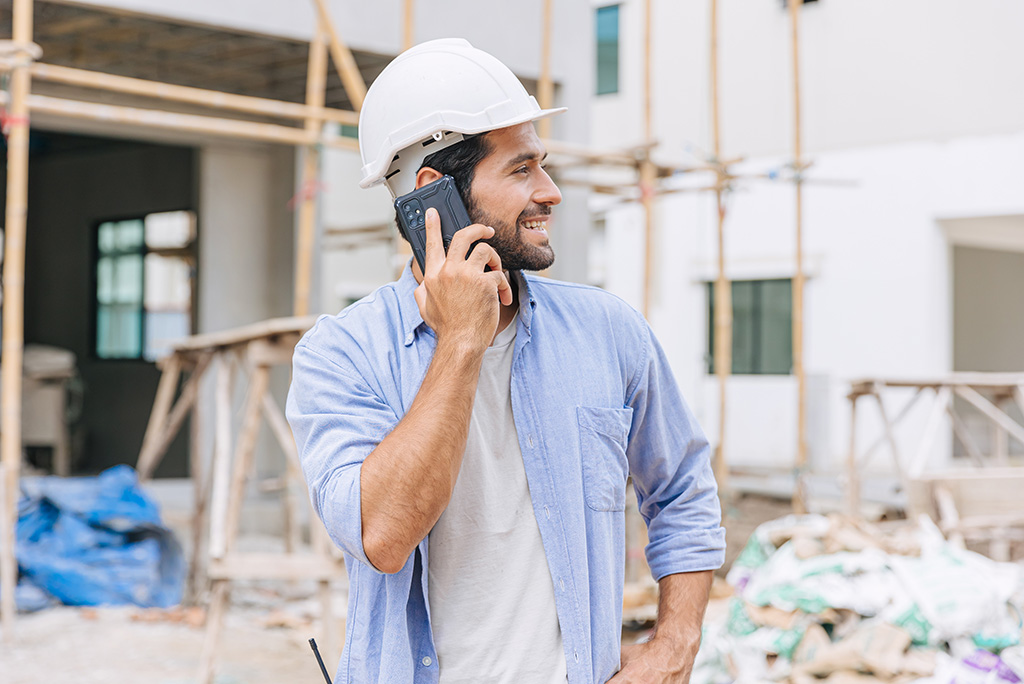 construction worker talking on the phone