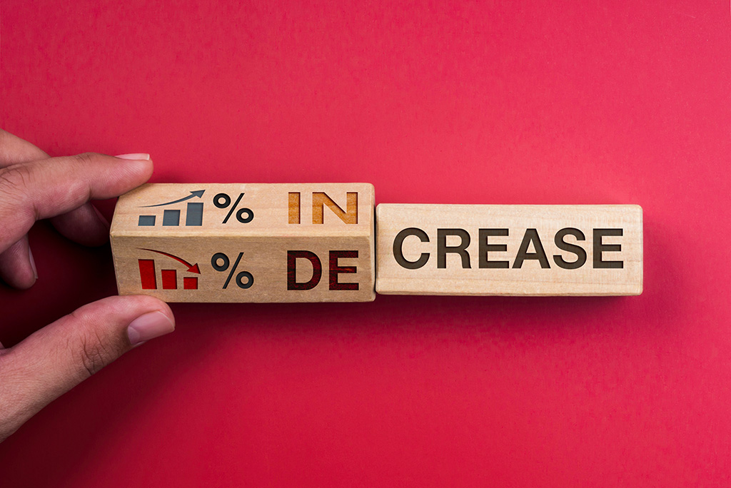 wooden block being turned from increase to decrease