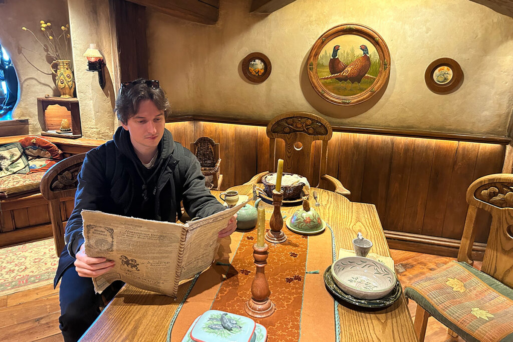 man reading in hobbit house