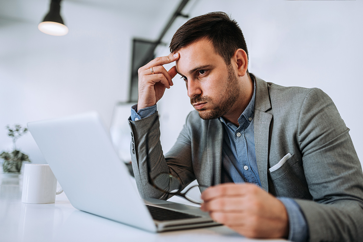 stressed business man working on his laptop